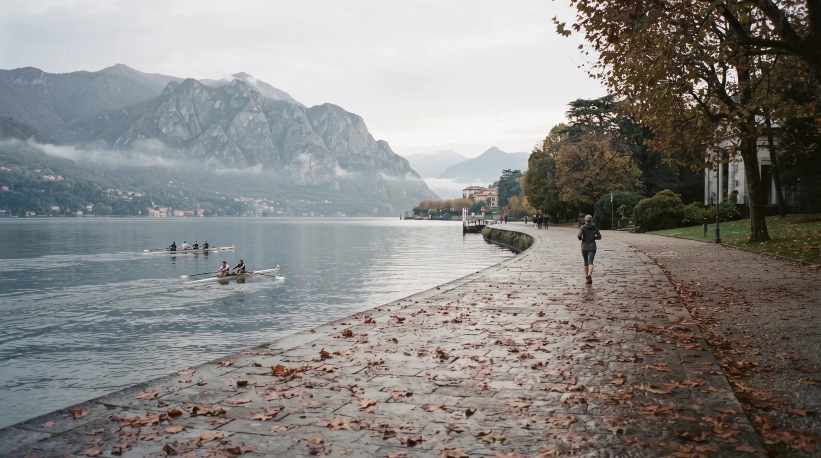 The lakefront promenade and mountain wall at Como on an October morning, Lake Como