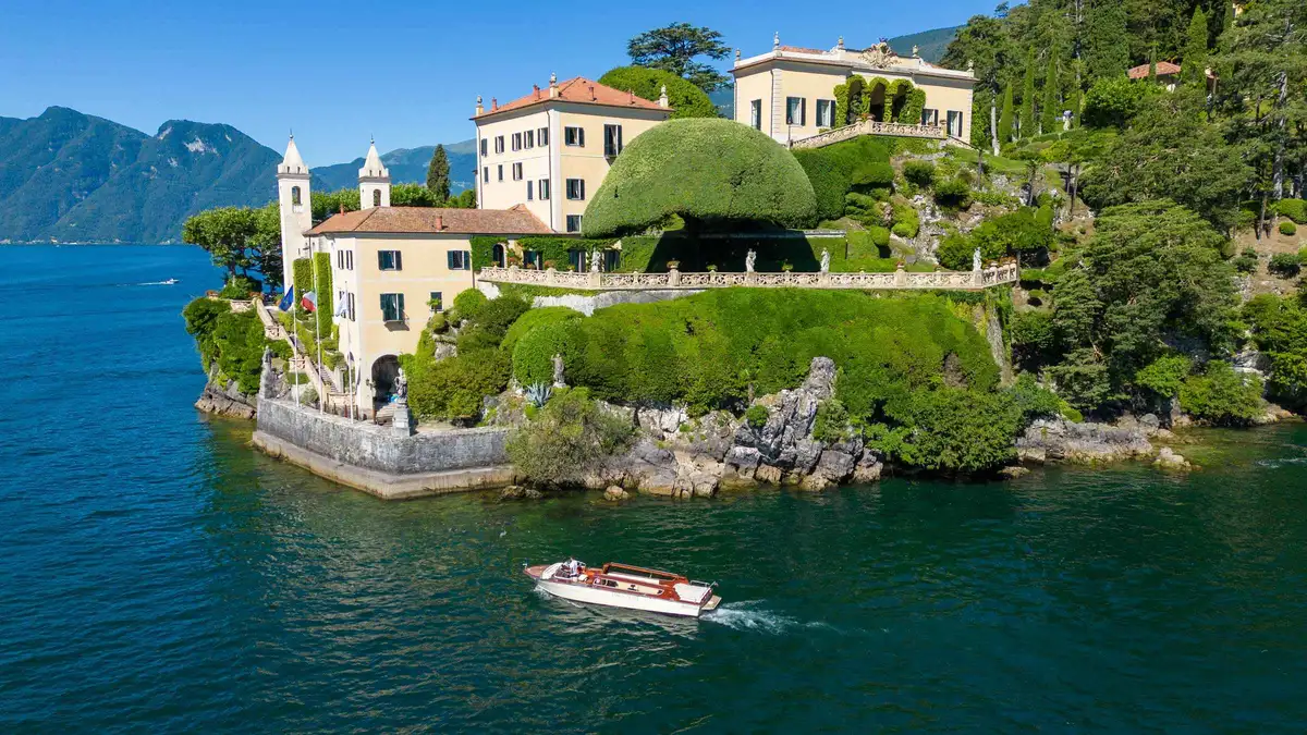 Venetian-style taxi boat leaving Varenna for Villa del Balbianello on Lake Como