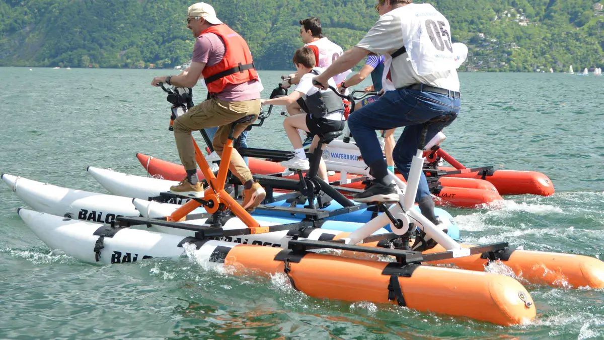 Water bikes on the lake off Laglio near the Orrido di Nesso on Lake Como