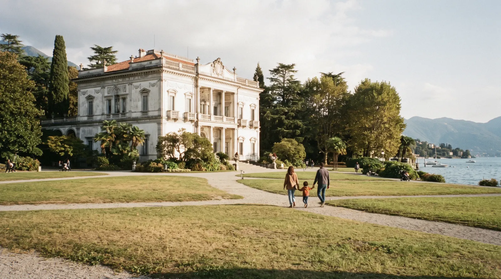 The neoclassical facade of Villa Olmo above its formal garden and fountain on the Como lakefront